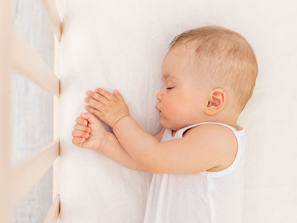 Por que é que os bebés suam tanto quando dormem